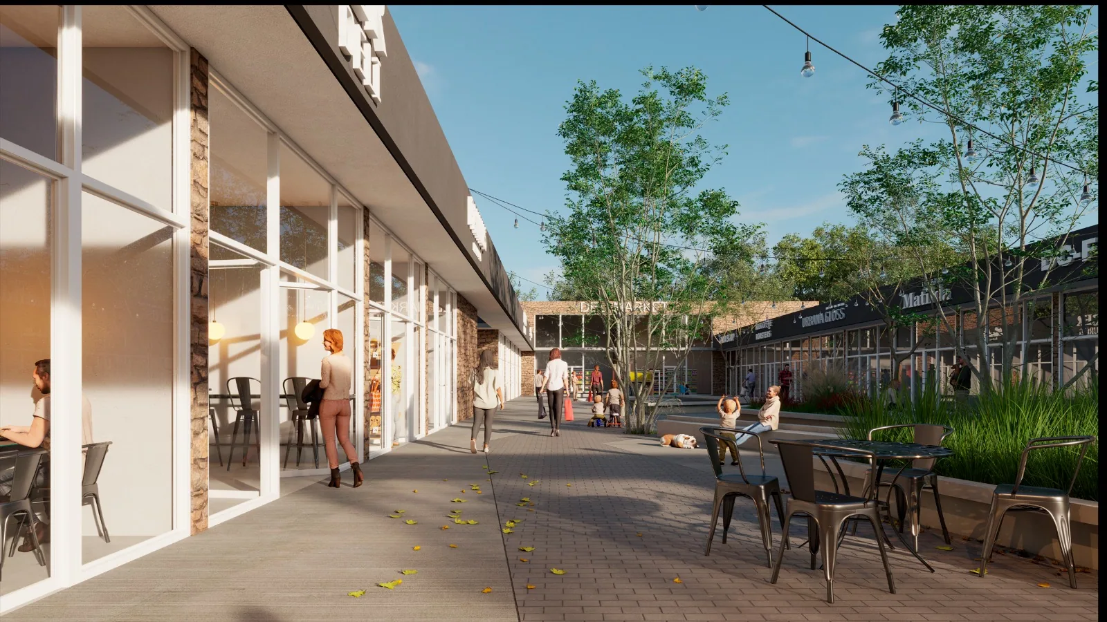 Paseo comercial interno de Portal Haras con vidrieras, terrazas y vegetación integrada